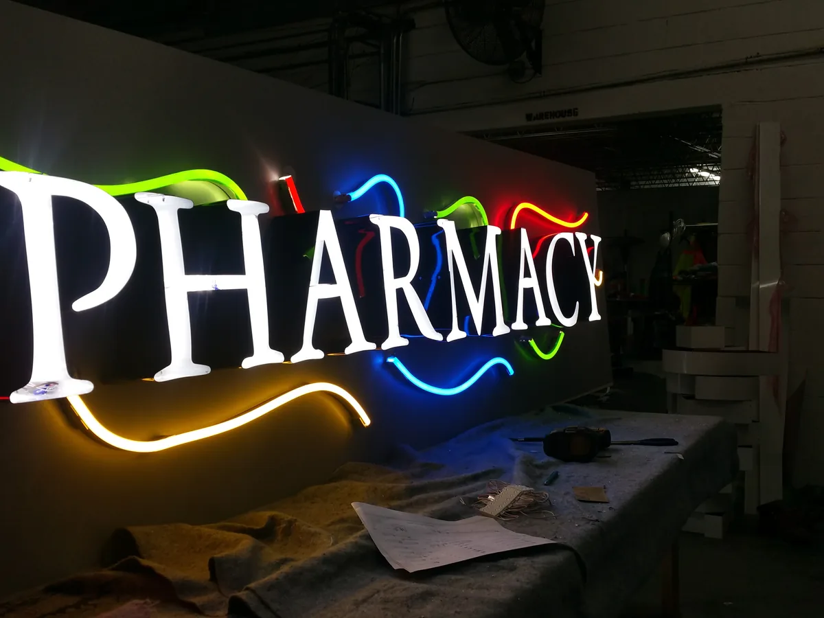 In our shop — lit up before install — sign built and installed by Signs VW Orlando