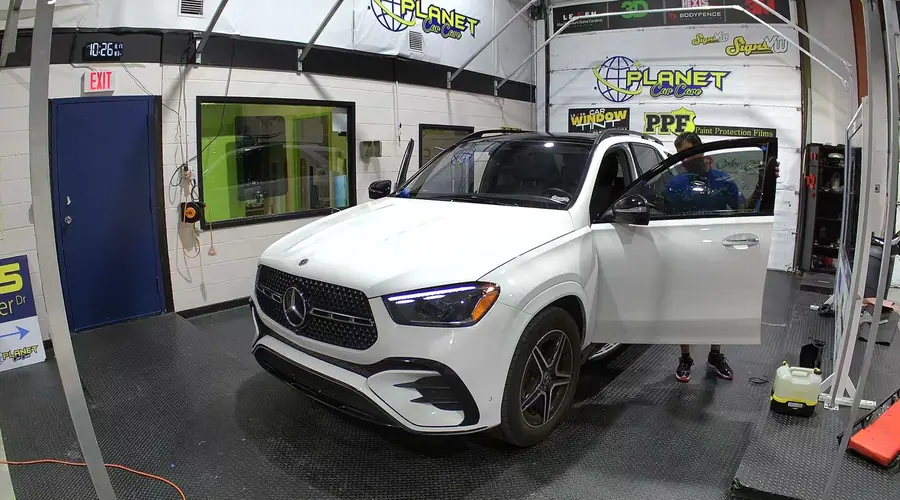 Tint film being applied to a car window
